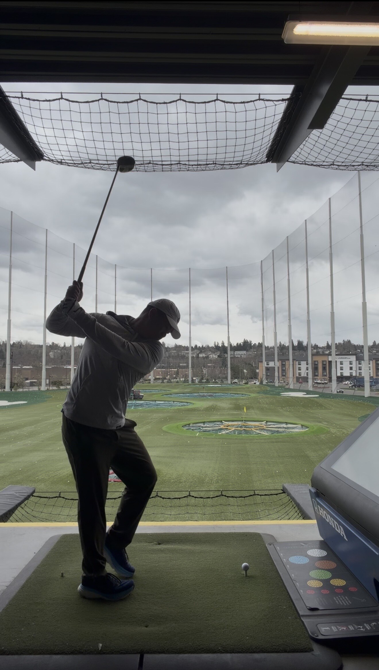Top of the backswing at a Topgolf bay--the data this swing generates is what I was digging through when I found the typo
